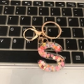 Letter S keychain in rose gold with transparent resin and colorful heart sequins - S