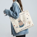 Off-white canvas tote bag featuring artistic girl and cat illustration with top handle - Princess and Cat - Beige