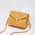 Minimalist yellow crossbody bag for women with gold clasp and white stitching detail - Yellow