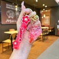 Detail of pink Sakura silicone wristband with glitter ball pendant and golden bell - Individual Packaging / [Red] Luminous Bubble Bead Lollipop