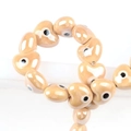 Handmade heart-shaped glazed ceramic beads with evil eye pattern for DIY jewelry crafts - 13x14mm / Camel
