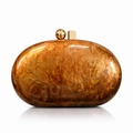 Detail of acrylic evening clutch with amber marble texture and gold clasp detail - Coffee