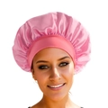 Pink satin sleep bonnet with wide elastic band for hair care, shown on a model - Deep Pink