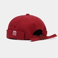 Detailed close-up of a red miki hat showing the metal buckle and white letter m embroidery - Adjustable / Dark Red