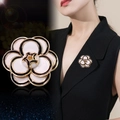 Elegant camellia flower brooch in black and white enamel with golden metal edges - White Camellia Flower