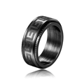 Detail view of black rotatable ring featuring classic Greek Key pattern and brushed texture - US 7 / Black