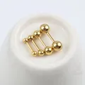 Orecchini a bilanciere dorati in acciaio inossidabile in quattro dimensioni su base bianca - 3mm / Oro