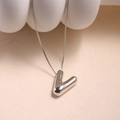 Minimalist silver V-letter pendant necklace with a polished metallic finish and fine chain - Letter V - Silver