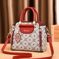 Classic red faux leather handbag with monogram pattern and gold leaf pendant accessory - Khaki & Wine Red