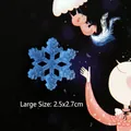 Blue resin snowflake charm with silver glitter showing 2.5x2.7cm size details - Large / Blue