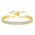 Détail d'un bracelet tennis double rangée avec oxydes de zirconium et fermoir ajustable - Doré