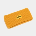 Detailed close-up of yellow knit sports headband with STOP THE VILLAIN label texture - One Size / Ginger Yellow