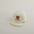 Close-up of baby beige cotton cap featuring embroidered bear and Lucky lettering - 50cm 1-2 Years / White