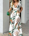 Detail view of white floral V-neck wide leg jumpsuit with green and brown botanical prints - S / White Leaf