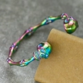 Retro punk style skull bone titanium steel bracelet with colorful iridescent metallic finish - Rainbow