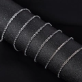 Polished silver stainless steel cross chain wrapped on a dark textured display cylinder - 03 Flat Cross (1mm) / Steel