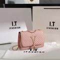 Pink crossbody bag with V-shaped quilting, gold fringe logo, and elegant chain strap - Pink