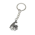 Macro detail of retro silver nautical keychain with sailing boat and ship wheel pendants - Sailing Ship Style