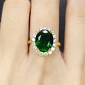 Vintage smaragdgroene ring met ovale groene edelsteen en diamanten halo op gouden band - Verstelbare Ring