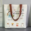 Canvas tote bag in cream white with brown handles featuring artistic girl and hamster prints - Best Self