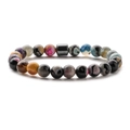 Detailed close-up of 8mm natural stone beads and magnetic hematite cylinder on mens bracelet - Colored Agate