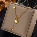 Layered gold stainless steel necklace with heart and star charms on jewelry box - Heart Star Style (N1243)