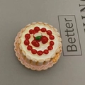 3D simulation cake fridge magnet with cream and cherry detail on grey surface - Strawberry Cake