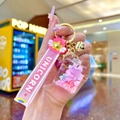 Pink unicorn liquid sand keychain with silicone strap and golden bell charm - Luminous Donut Bow Perfume Bottle