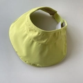 Detail view of the neon green UPF50+ sun visor hat showing adjustable strap and fabric - Neon Yellow