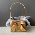 Detail of seagrass basket featuring gold ribbon bow and white star tulle lining - Antique Gold Half Wrap Style