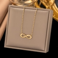Elegant gold infinity symbol necklace displayed on a brown premium jewelry box - Infinity Symbol (AH232) / Gold