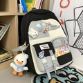 Cute black and white school backpack with plush duck charm and colorful badges - Backpack with Charms and Badges / Black