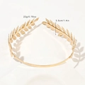 Detailed macro shot of golden laurel leaf crown showing delicate metal texture and polished finish - Metal Headband-2 Twill Leaves