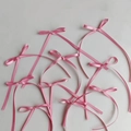 Standard pink satin ribbon bows with long streamers scattered on white background - Deep Pink Medium (10pcs) 8*13CM