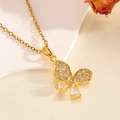 Macro close-up of gold butterfly pendant with diamonds and pearls on soft fabric - Gold Bowknot Water Drop Diamond Necklace