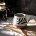 Minimalist ceramic mug with black arrows and terracotta base on newspaper background - Triangle / Cream/Brown