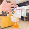 Cute white plush duck keychain with blue denim hat and small toast crossbody bag - Plush Crooked Neck Backpack Duck / White