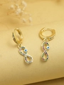 Detailed shot of golden infinity hoop earrings with blue evil eye and colorful zircons - Infinity Evil Eye (E5)