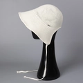 Close-up of white knitted sun hat with breathable mesh texture and adjustable long straps - M(56-58cm) / White