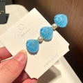 Detailed close-up of blue shell and white pearl hair clip on a paper display card - 2# Pearl Shell - Blue