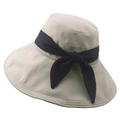Detail of beige wide-brim sun hat with dark blue bow ribbon on high-quality fabric - M (56-58cm) / Light Khaki