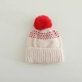 Detail of knit hat featuring red heart patterns, ribbed brim and fluffy pom-pom - 3-10 Years / Red