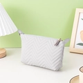 Grey dumpling cosmetic bag with wave pattern, PU material, and elegant gold zipper - Wave Quilted Style / Gray Dumpling Bag
