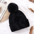 Women's black faux fur knitted beanie with a large fluffy pompom for winter warmth - Black