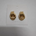 Three interlocking circular golden earrings with a polished finish on white card - 15.6X23.3 Small Gold Style