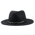 Detail of black straw sun hat showing ethnic style ribbon and silver feather charm - Black