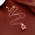 Dettaglio del ciondolo orsetto in oro rosa con pietre rosa e cuore rosso su velluto - Collana-Oro Rosa-Rosa