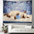 Christmas tapestry featuring a sleeping Siamese cat with blue ornament on white sofa wall - Siamese Cat Hugging Blue Christmas Ball
