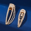 Golden rhinestone BB hair clips with sparkling tassels on deep blue background - Set of 2