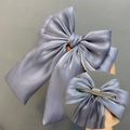 Elegant lavender blue triple-layer bow hair clip with shimmering metallic satin texture - Grey Duckbill Clip